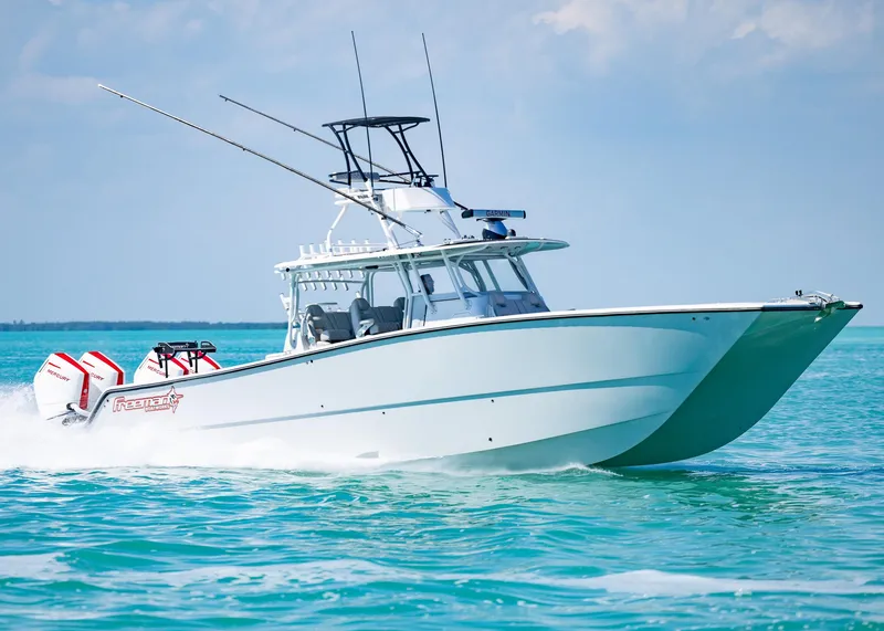 Slide: The Image of 2019 Freeman 42 LR boat cruising on turquoise waters. - 49