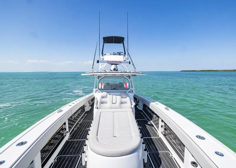Slide: The Image of 2019 Freeman 42 LR boat on clear blue water under a sunny sky. - 9