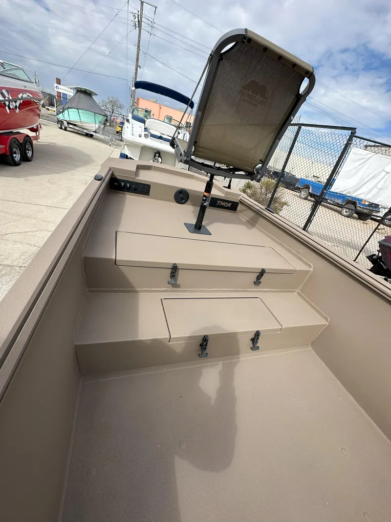 Slide: The Image of 2025 Thor 1754 Timber Hammer boat interior with seating and storage compartments. - 7