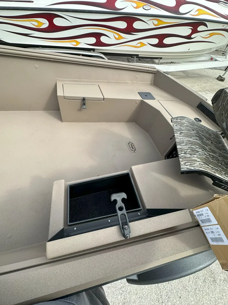 Slide: The Image of 2025 Thor 1754 Timber Hammer boat interior with storage compartments and modern design. - 9