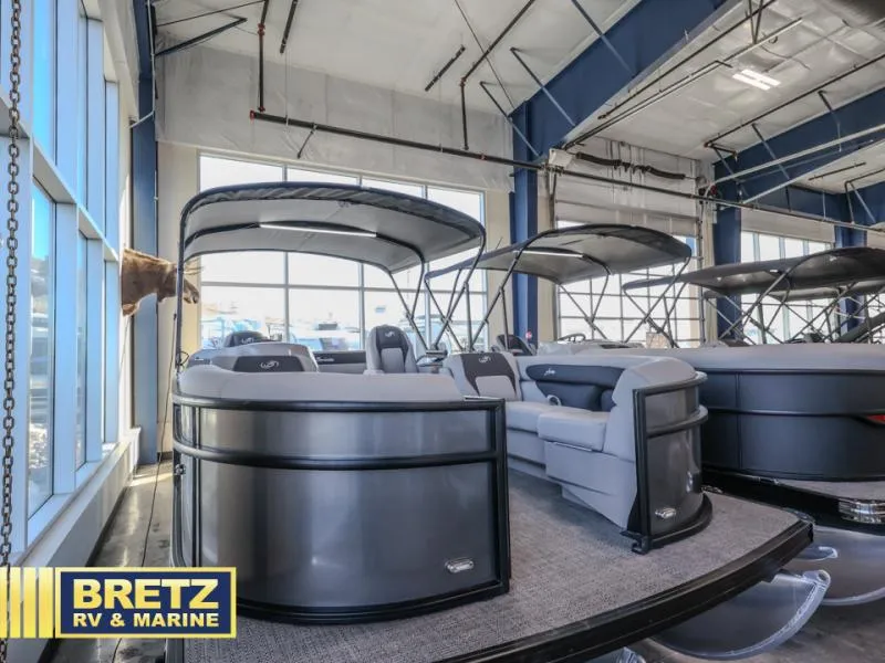 Slide: The Image of 2025 Aria Ultra-Lounge A22UC pontoon boat displayed at Bretz RV & Marine showroom. - 4