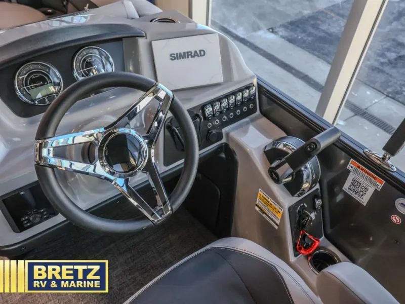 Slide: The Image of Cockpit of 2025 Aria Ultra-Lounge A22UC with steering wheel and Simrad display. - 6