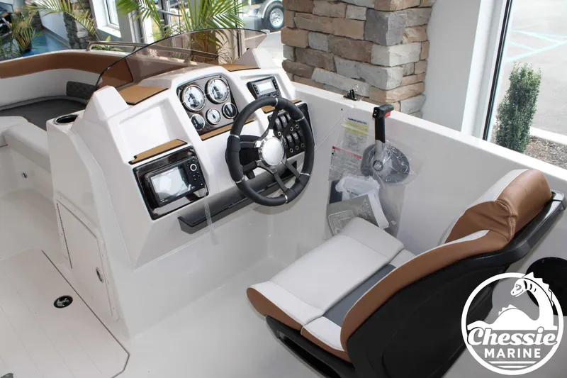 Slide: The Image of 2025 Starcraft SVX 211 OB boat cockpit with modern steering and controls. - 6