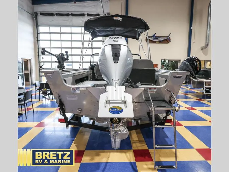 Slide: The Image of 2020 Pro Angler XL 182 XL boat displayed indoors at Bretz RV & Marine showroom. - 6