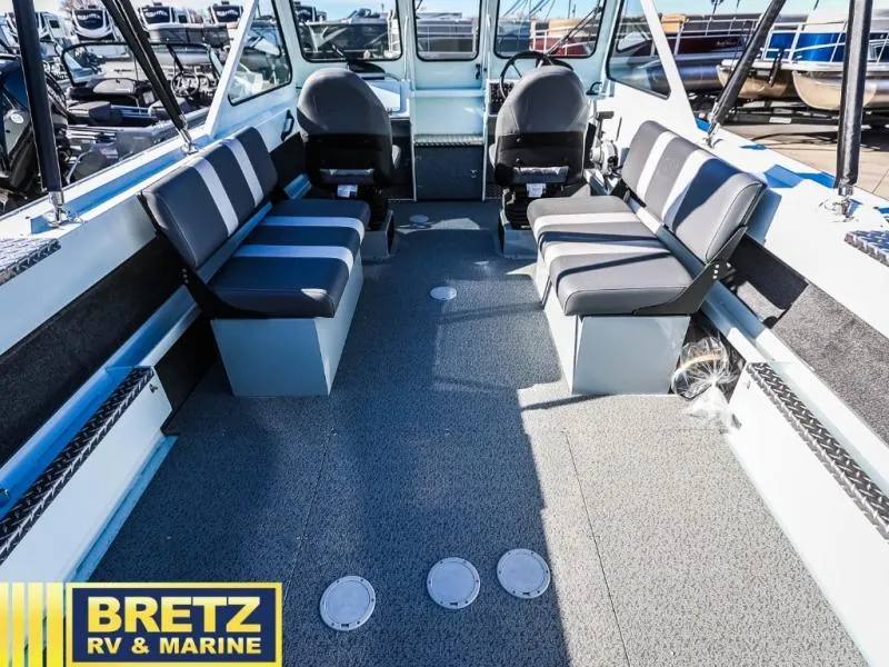 Slide: The Image of 2024 Sea Runner 210 SRET boat interior with seating, showcased by Bretz RV & Marine. - 10