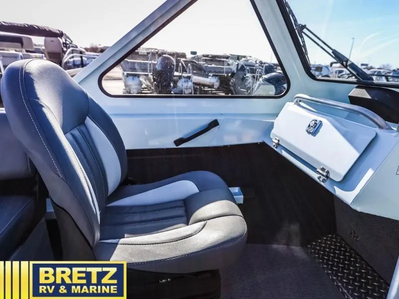 Slide: The Image of 2024 Sea Runner 210 SRET boat interior with comfortable seating and modern design. - 13