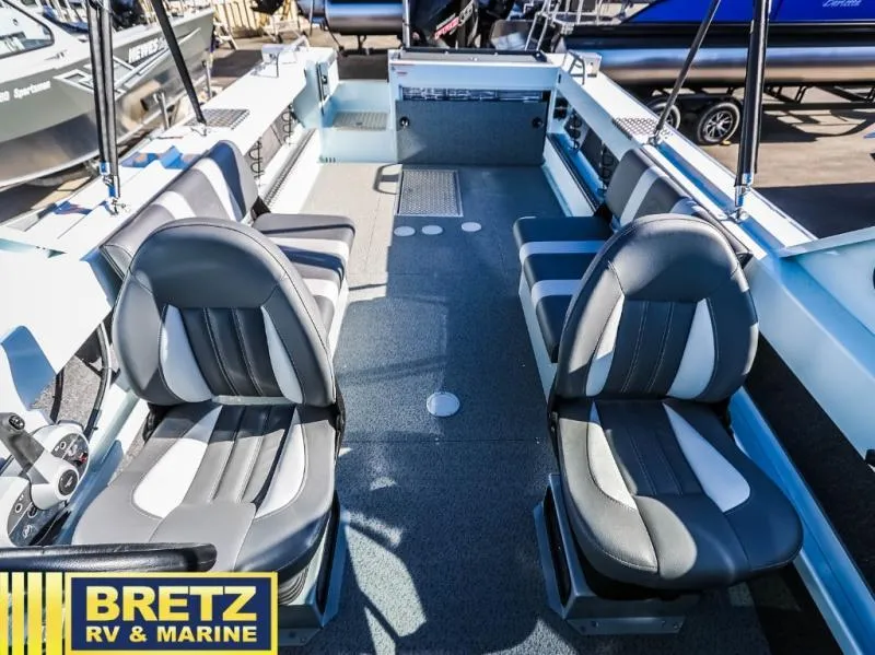 Slide: The Image of 2024 Sea Runner 210 SRET boat interior with seating, showcased at Bretz RV & Marine. - 17
