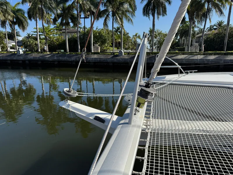 Slide: The Image of 2018 Fountaine Pajot Saona 47 catamaran docked by palm trees. - 20
