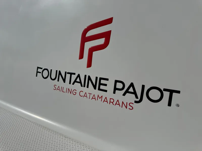 Slide: The Image of Fountaine Pajot Saona 47 logo on a 2018 sailing catamaran. - 24