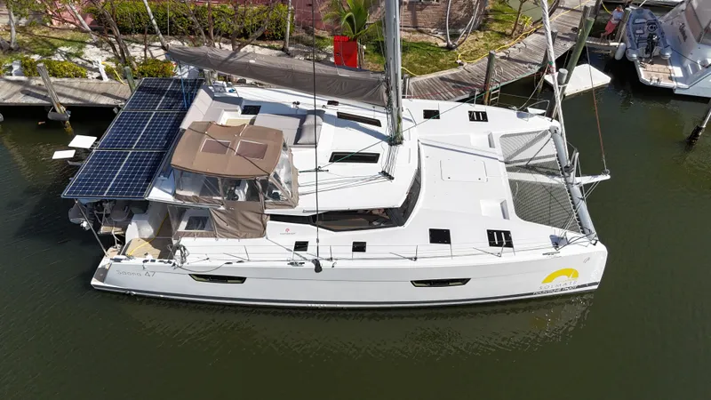 Slide: The Image of 2018 Fountaine Pajot Saona 47 catamaran with solar panels docked in a marina. - 3