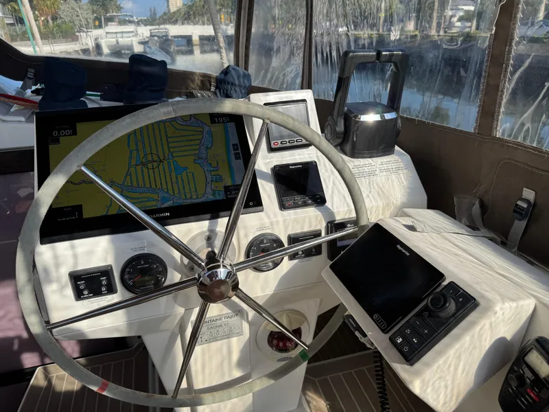 Slide: The Image of Helm of 2018 Fountaine Pajot Saona 47 with navigation equipment and steering wheel. - 34