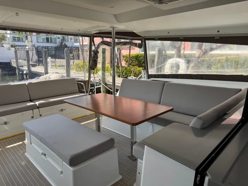 Slide: The Image of Spacious interior of 2018 Fountaine Pajot Saona 47 catamaran with comfortable seating and wooden table. - 39