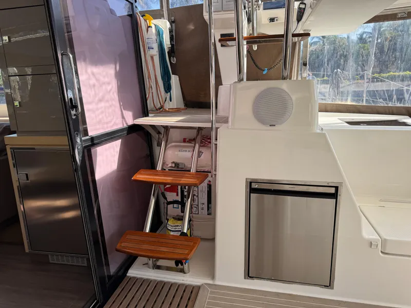 Slide: The Image of Interior view of 2018 Fountaine Pajot Saona 47 catamaran with wooden steps and storage. - 43