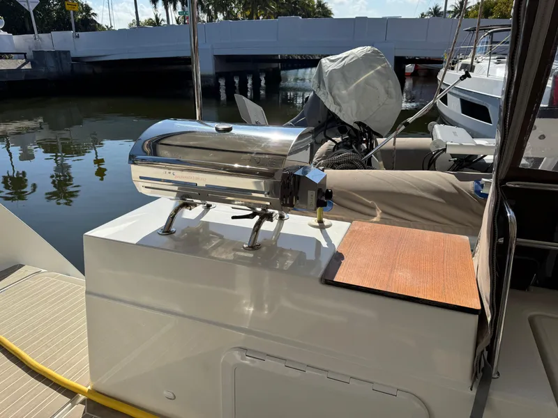 Slide: The Image of Outdoor grill on 2018 Fountaine Pajot Saona 47 catamaran, docked by a calm waterfront. - 47