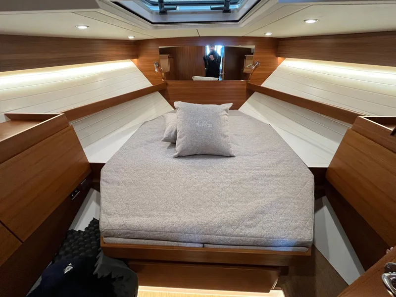 Slide: The Image of Luxurious cabin interior of 2025 Delta Powerboats 400 SW with elegant wood finish. - 14