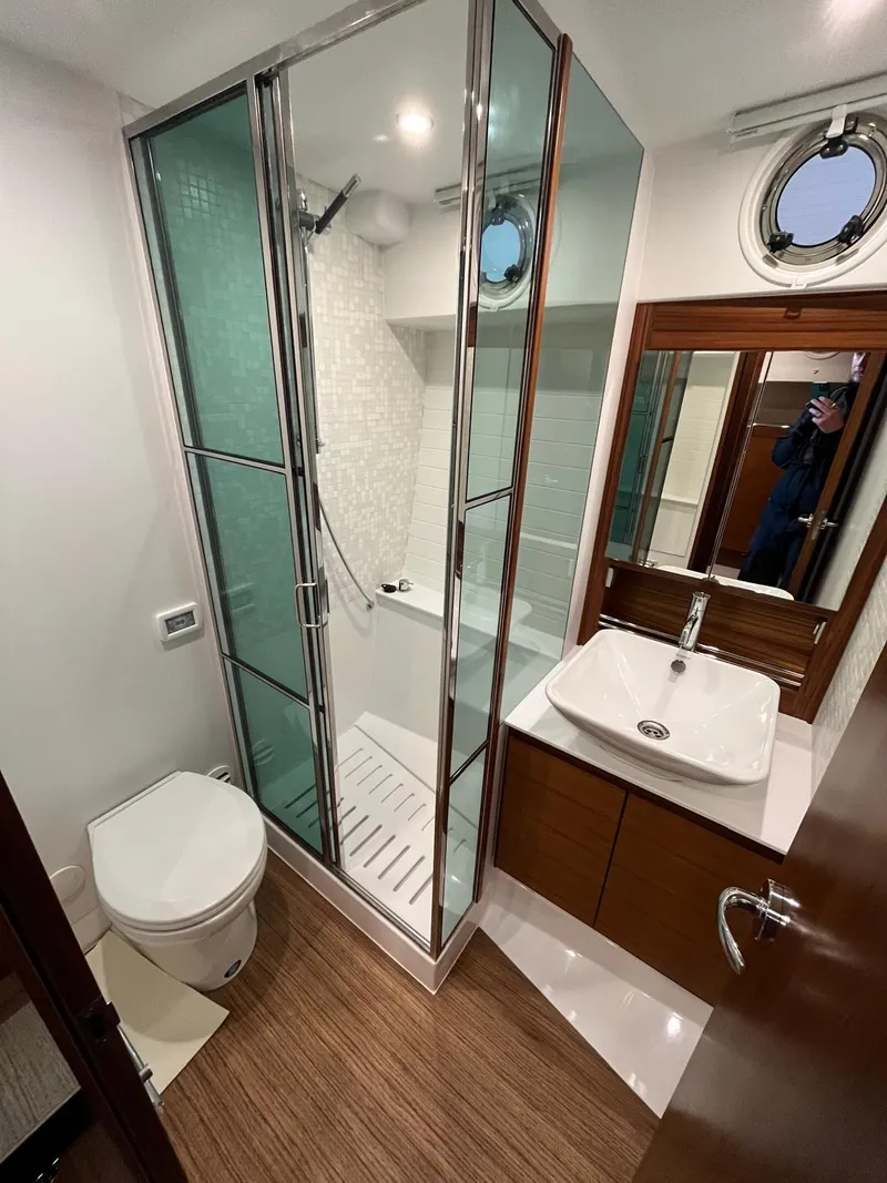 Slide: The Image of Bathroom interior of 2025 Delta Powerboats 400 SW, featuring modern shower and sink. - 16