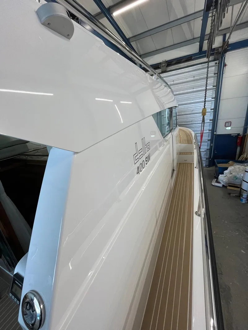 Slide: The Image of 2025 Delta Powerboats 400 SW in a garage, showcasing sleek design and craftsmanship. - 9