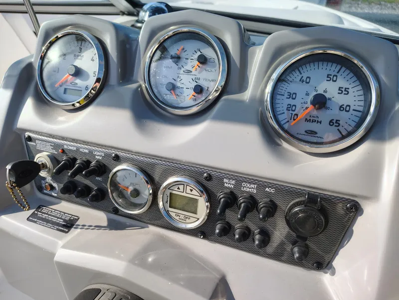 Slide: The Image of Dashboard of 2012 Chaparral 18 Sport H2O boat with gauges and controls. - 13