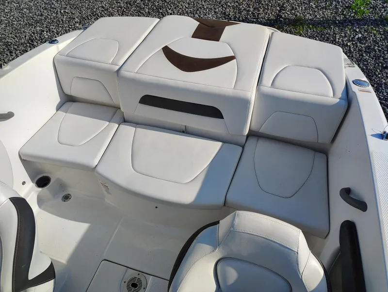 Slide: The Image of 2012 Chaparral 18 Sport H2O boat interior with white cushioned seating. - 15