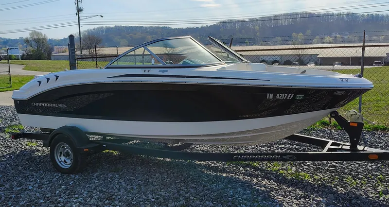 Slide: The Image of 2012 Chaparral 18 Sport H2O boat on trailer, parked outdoors on gravel. - 4