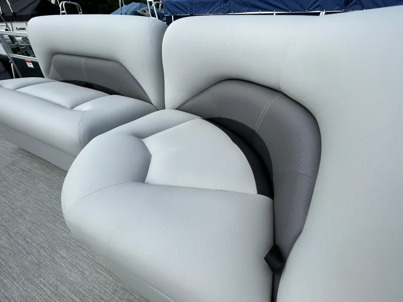 Slide: The Image of 2023 Landau Island Breeze 232 Cruise boat seating, featuring plush gray upholstery. - 4