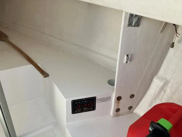 Slide: The Image of Interior of 2015 Colgate Sloop showing control panel and storage area. - 7