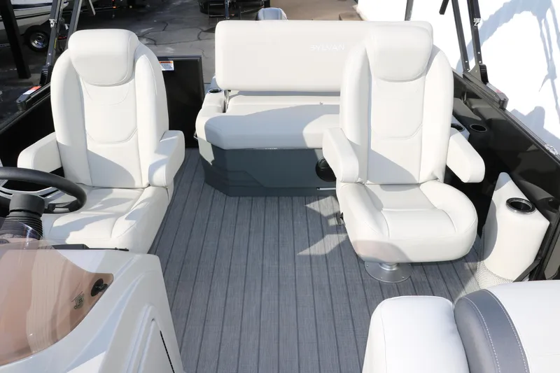 Slide: The Image of 2025 Sylvan 820 CLZ DH Premium Pontoon interior with plush white seating and modern design. - 24