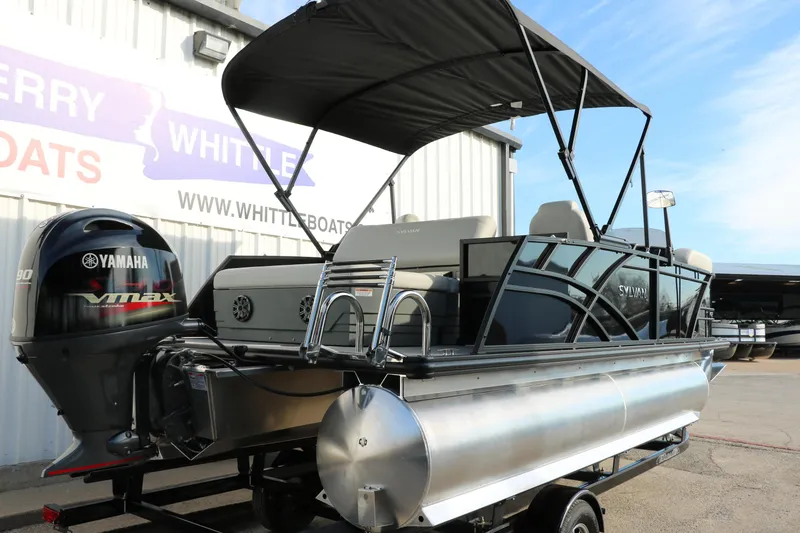 Slide: The Image of 2025 Sylvan 820 CLZ DH Premium Pontoon with Yamaha engine, parked at dealership. - 3