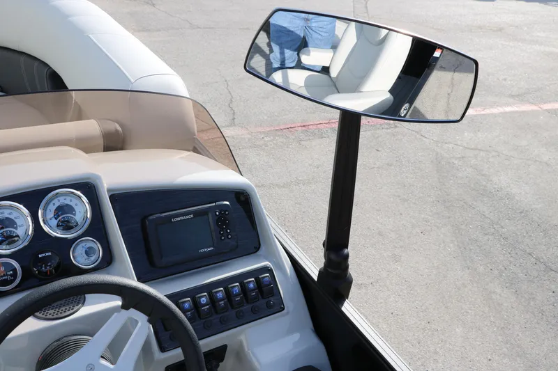 Slide: The Image of 2025 Sylvan 820 CLZ DH Premium Pontoon dashboard with steering wheel and rearview mirror. - 30