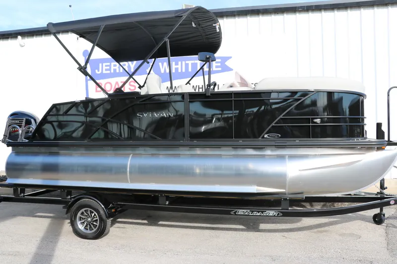 Slide: The Image of 2025 Sylvan 820 CLZ DH Premium Pontoon with black canopy on trailer. - 8