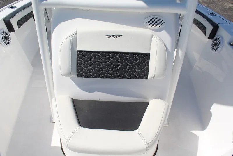 Slide: The Image of 2025 Tidewater 210 LXF boat seat with black and white upholstery design. - 18