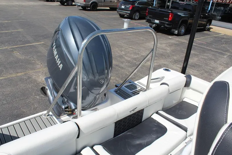 Slide: The Image of 2025 Tidewater 210 LXF boat with Yamaha engine, parked in a lot. - 24