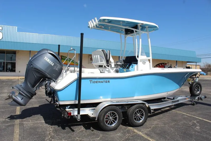Slide: The Image of 2025 Tidewater 210 LXF boat with Yamaha engine on trailer, parked outdoors. - 3