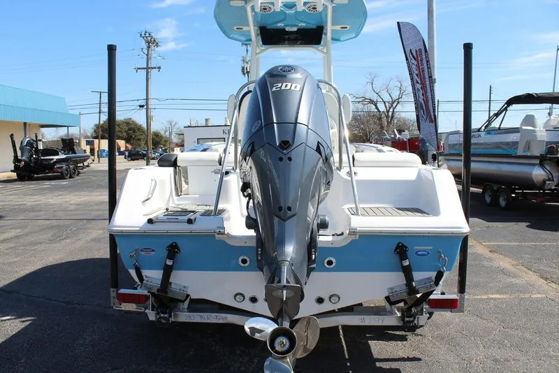Slide: The Image of 2025 Tidewater 210 LXF boat with powerful outboard motor, displayed in a parking lot. - 5
