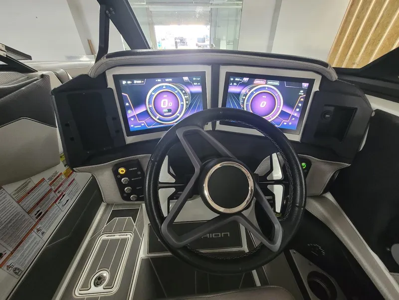 Slide: The Image of 2021 Centurion Ri245 dashboard with dual digital displays and steering wheel. - 11