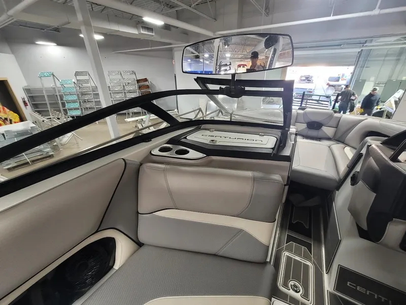 Slide: The Image of Interior of a 2021 Centurion Ri245 boat with modern seating and dashboard. - 13