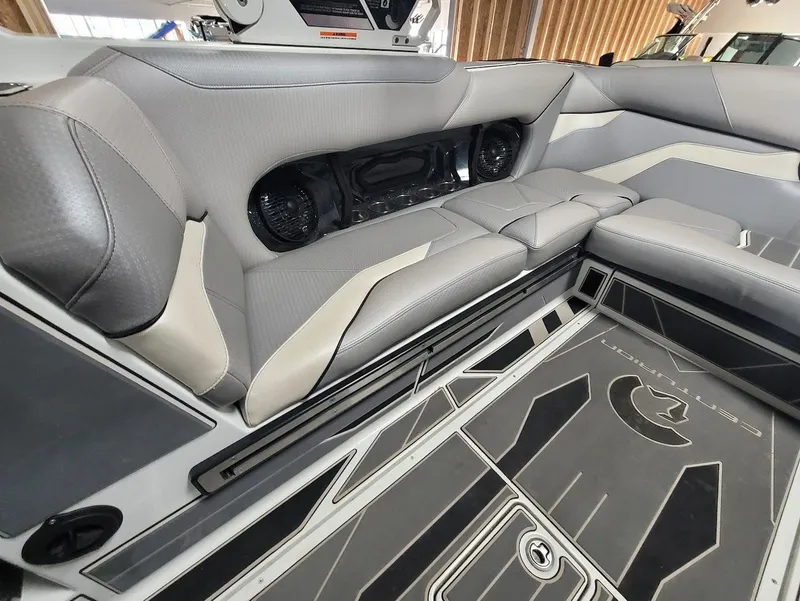 Slide: The Image of Interior of 2021 Centurion Ri245 boat with sleek gray seating and modern design. - 15