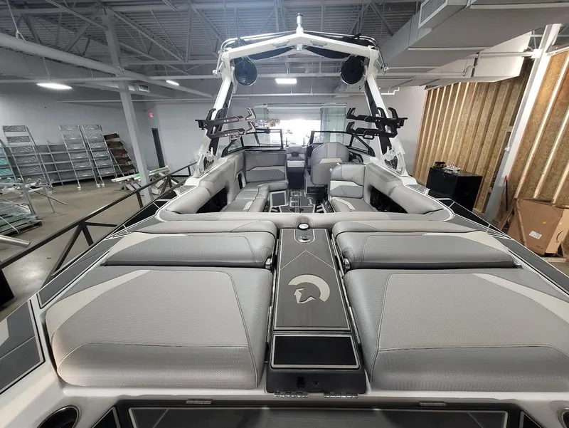 Slide: The Image of 2021 Centurion Ri245 boat interior with spacious seating and modern design. - 23