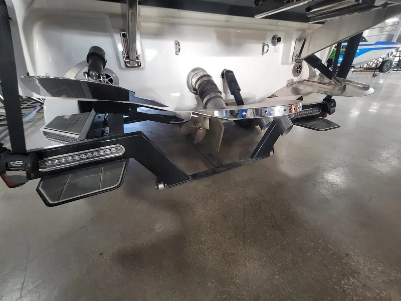 Slide: The Image of Rear view of a 2021 Centurion Ri245 boat with advanced wakeboard features. - 25