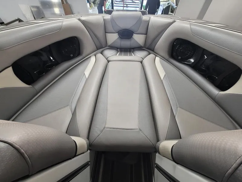 Slide: The Image of 2021 Centurion Ri245 boat interior with luxurious seating and modern design. - 9