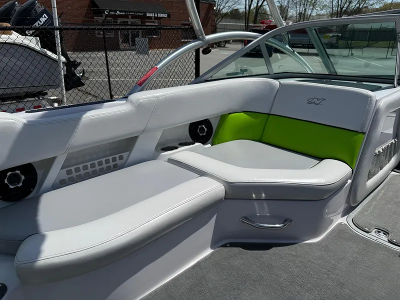 Slide: The Image of 2007 Nautique Air SV-211 boat interior with gray and green seating. - 12