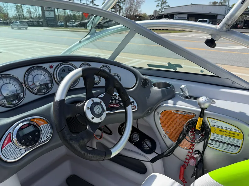 Slide: The Image of 2007 Nautique Air SV-211 boat dashboard with steering wheel and gauges. - 17
