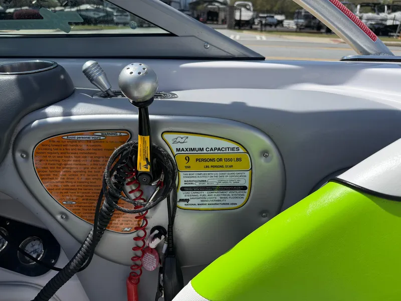 Slide: The Image of 2007 Nautique Air SV-211 boat interior with capacity label and control panel. - 18