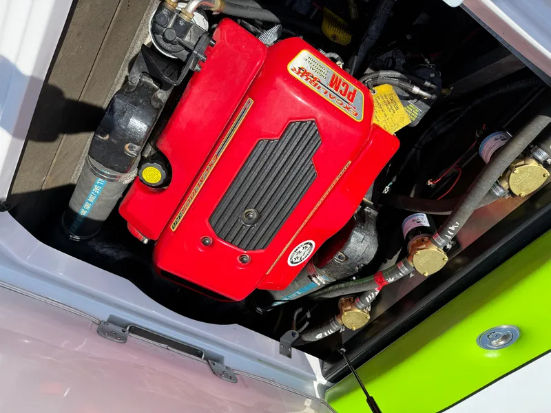 Slide: The Image of 2007 Nautique Air SV-211 engine compartment with red PCM engine cover. - 23