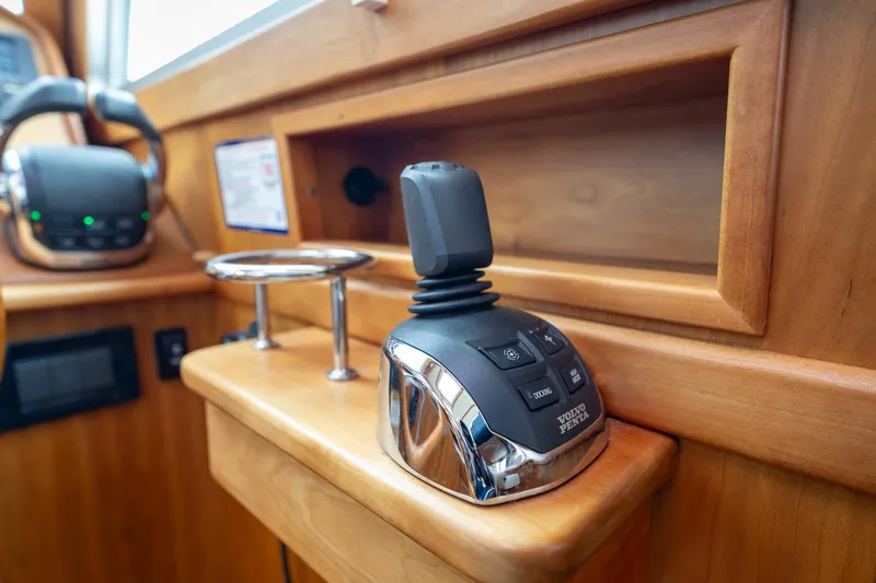 Slide: The Image of Control panel of 2014 Sabre 38 Salon Express yacht with joystick and cup holder. - 13