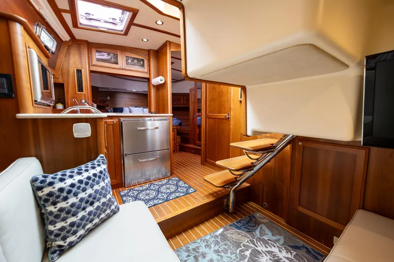 Slide: The Image of Interior of 2014 Sabre 38 Salon Express yacht, featuring wood finishes and modern amenities. - 15