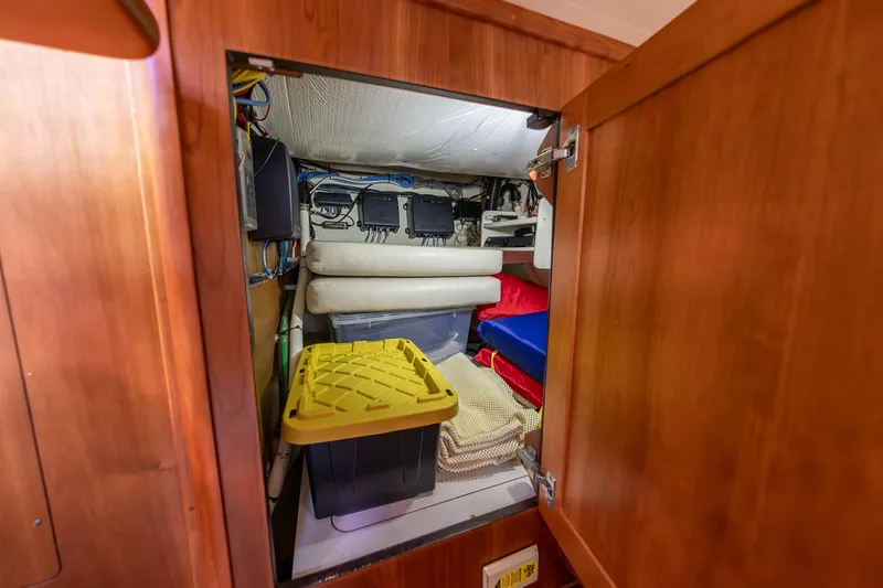 Slide: The Image of Storage compartment in 2014 Sabre 38 Salon Express, featuring organized equipment and supplies. - 16