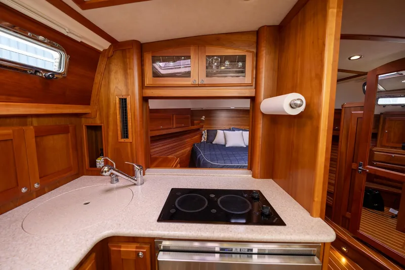 Slide: The Image of 2014 Sabre 38 Salon Express interior with kitchen and bedroom view. - 19