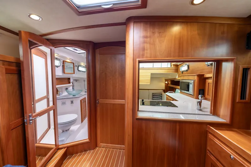 Slide: The Image of Interior of 2014 Sabre 38 Salon Express yacht, featuring wood finish and modern amenities. - 20
