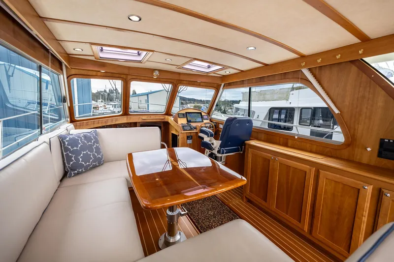 Slide: The Image of 2014 Sabre 38 Salon Express interior with elegant wood finish and spacious seating area. - 4